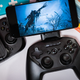 A photo of the Stratus+, surrounded by other controllers and some books